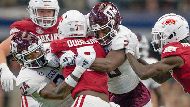Razorbacks running back Rashod Dubinion wrapped up by Texas A&M